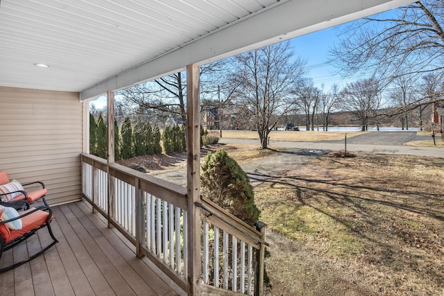 wooden terrace featuring a porch