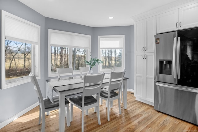 dining space featuring light hardwood / wood-style floors