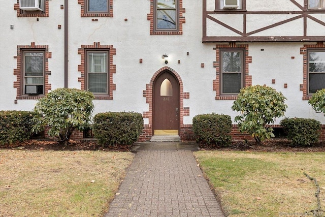 entrance to property with a yard