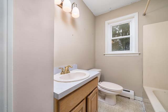 bathroom with a tub to relax in, a baseboard radiator, vanity, and toilet