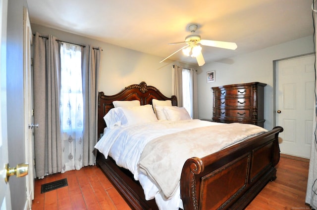 bedroom featuring wood-type flooring and ceiling fan