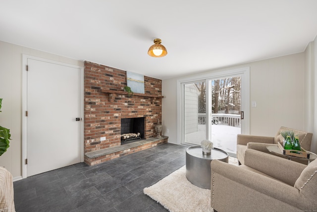 living room with a brick fireplace