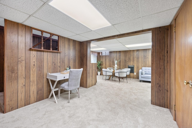 carpeted office featuring a paneled ceiling