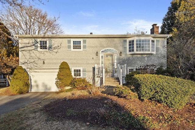 bi-level home featuring a garage