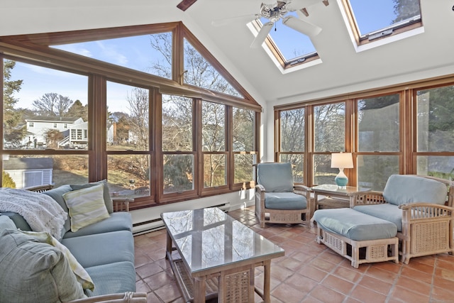 sunroom / solarium with a baseboard heating unit, ceiling fan, vaulted ceiling with skylight, and plenty of natural light