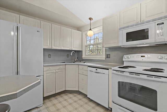 kitchen with pendant lighting, white appliances, white cabinetry, sink, and vaulted ceiling