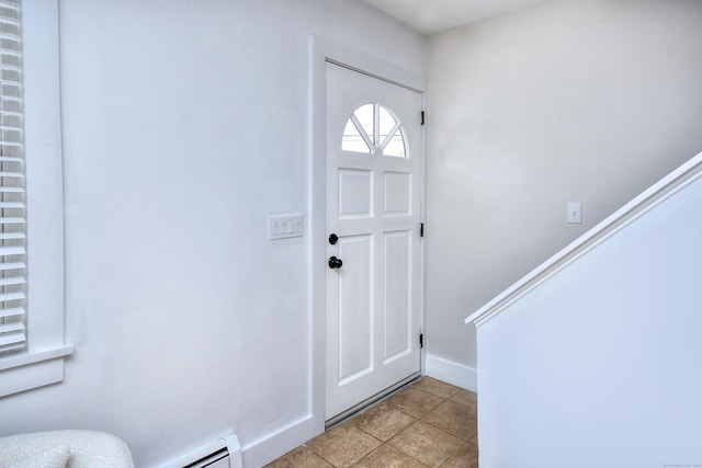 tiled entrance foyer featuring a baseboard radiator