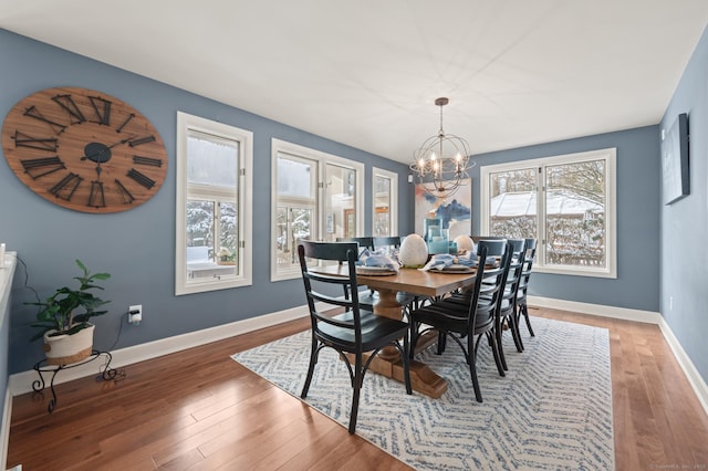 dining room featuring an inviting chandelier and hardwood / wood-style floors