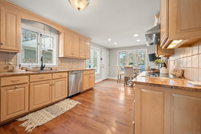 kitchen featuring dishwasher, backsplash, light stone countertops, black electric cooktop, and light brown cabinets