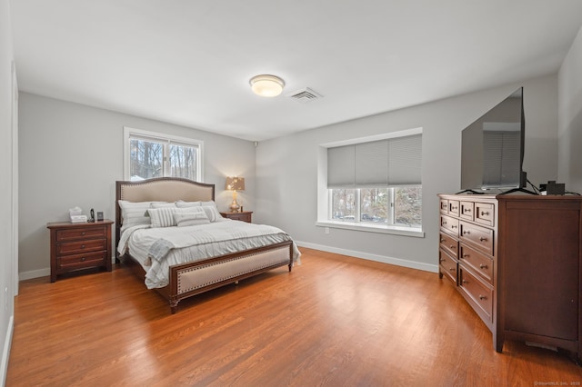 bedroom with wood-type flooring