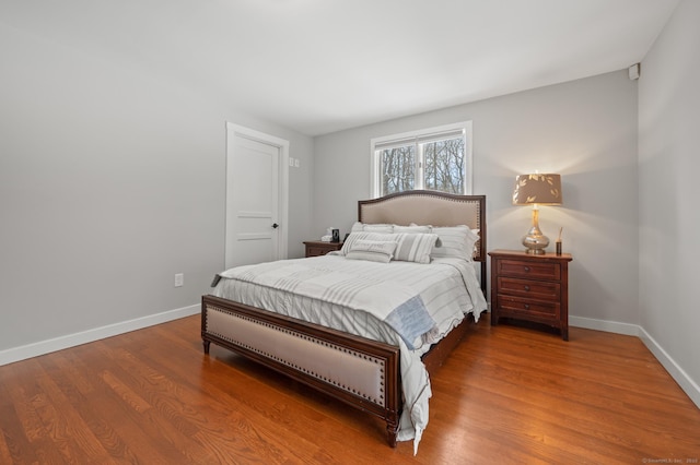 bedroom with wood-type flooring