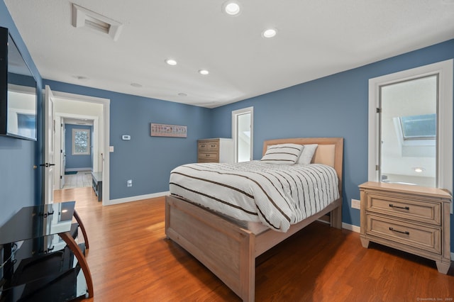 bedroom with dark wood-type flooring