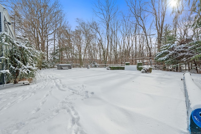 view of yard layered in snow