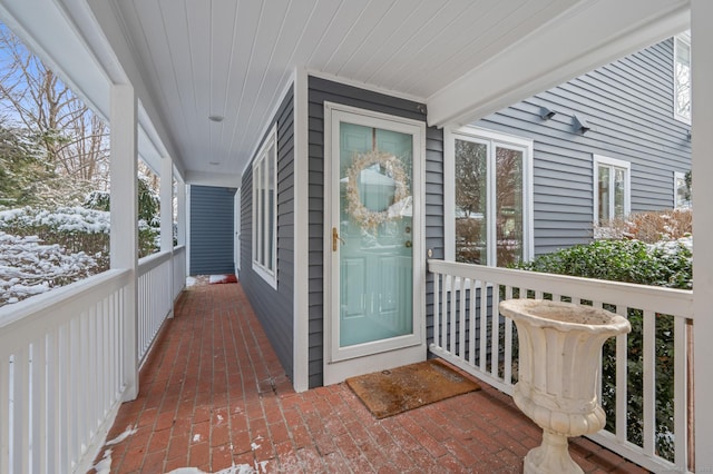 view of snow covered property entrance