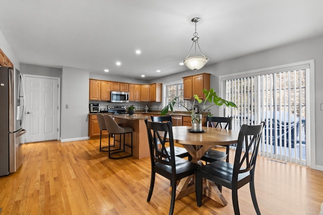 dining room with light hardwood / wood-style floors