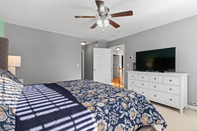 carpeted bedroom featuring ceiling fan