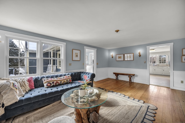 living room with plenty of natural light and wood-type flooring