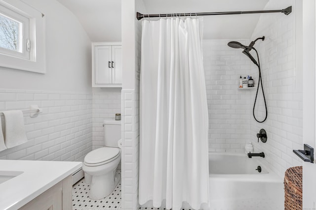 full bathroom featuring vanity, tile walls, shower / bath combo with shower curtain, and toilet