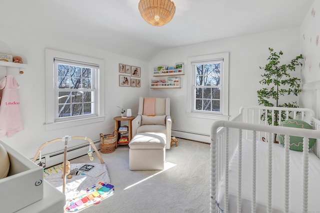 bedroom with a nursery area, multiple windows, and a baseboard heating unit