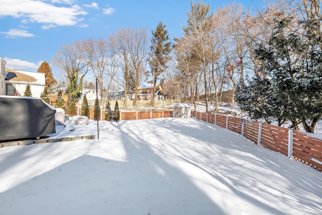 view of yard covered in snow