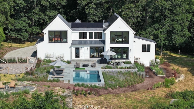 back of house featuring a patio area