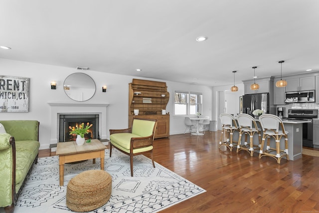 living room featuring dark hardwood / wood-style flooring