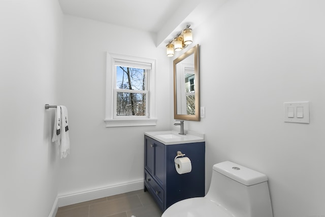 bathroom featuring vanity, toilet, and tile patterned flooring