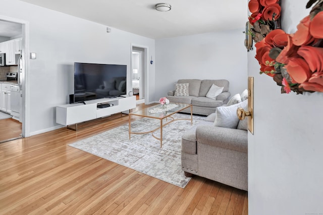 living room with light hardwood / wood-style floors