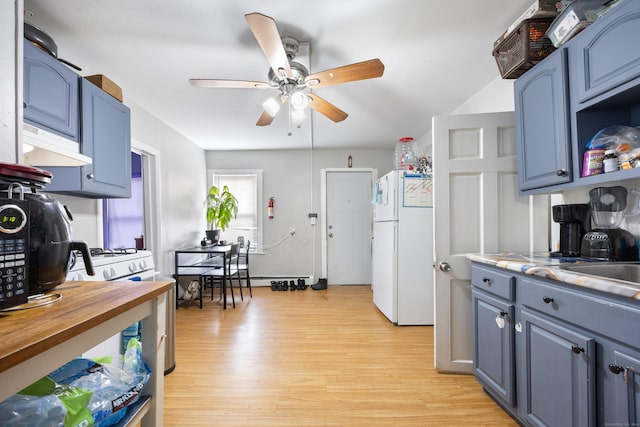 kitchen with white appliances, blue cabinetry, a baseboard radiator, light wood-type flooring, and ceiling fan