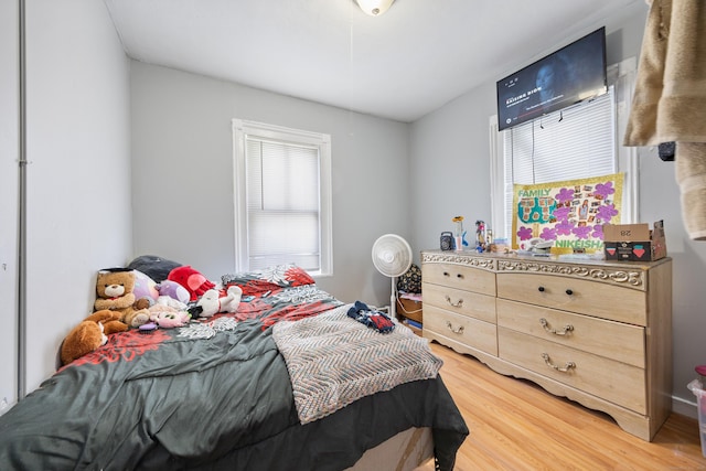 bedroom with wood-type flooring