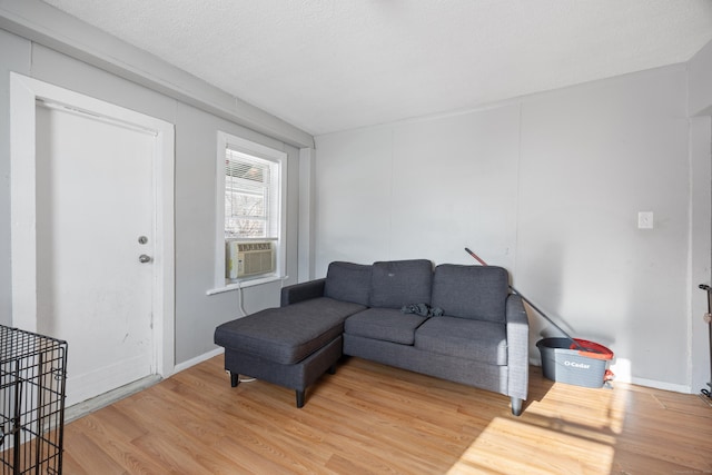 living room featuring wood-type flooring and cooling unit