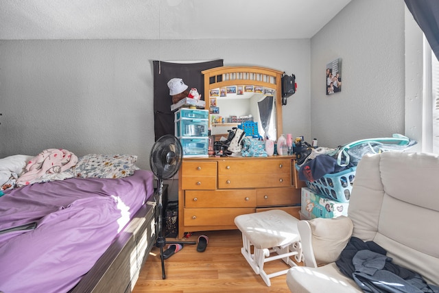 bedroom featuring wood-type flooring