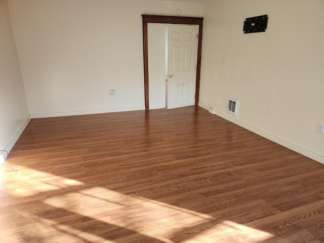 empty room featuring hardwood / wood-style flooring