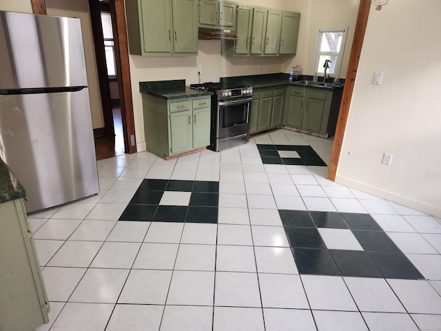 kitchen with sink, appliances with stainless steel finishes, and green cabinetry