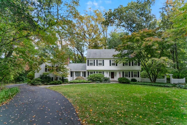 colonial inspired home with a front yard