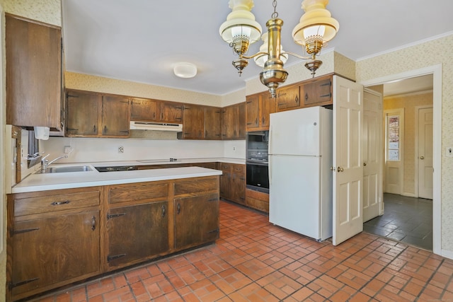 kitchen featuring hanging light fixtures, sink, an inviting chandelier, and black appliances