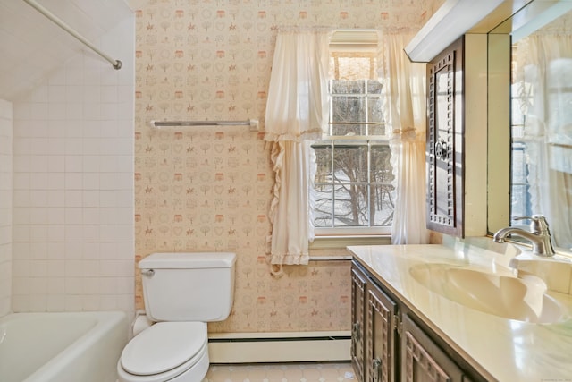 full bathroom featuring tile patterned flooring, vanity, a baseboard radiator, toilet, and tiled shower / bath