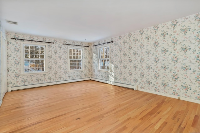 unfurnished room with light wood-type flooring