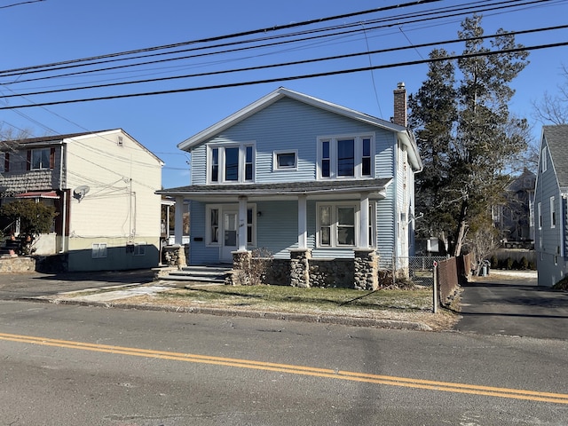 view of front of property featuring covered porch