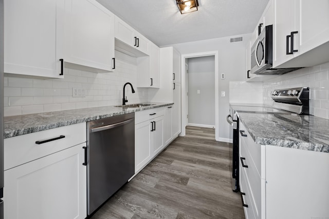 kitchen featuring sink, white cabinetry, and stainless steel appliances