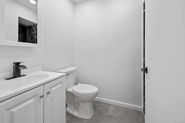 bathroom with toilet and vanity