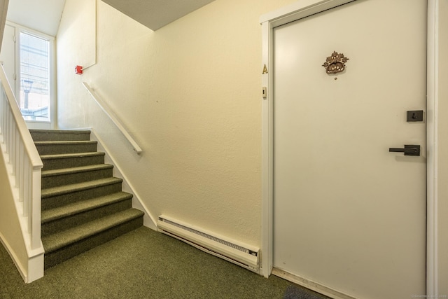 staircase featuring carpet flooring and a baseboard radiator