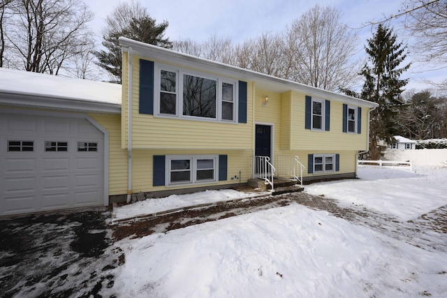 split foyer home featuring a garage