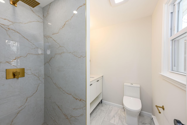 bathroom featuring vanity, toilet, walk in shower, and plenty of natural light