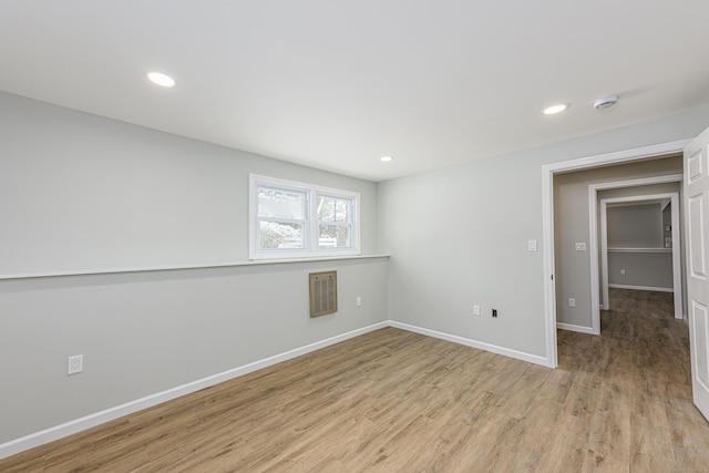 spare room featuring light wood-type flooring