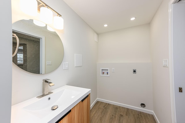 bathroom featuring hardwood / wood-style flooring and vanity