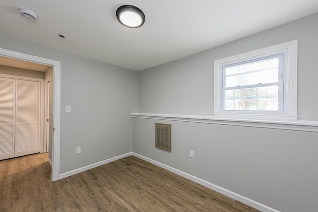 spare room featuring hardwood / wood-style flooring