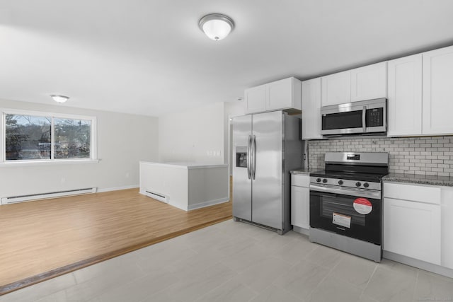 kitchen with stainless steel appliances, white cabinets, tasteful backsplash, and a baseboard radiator