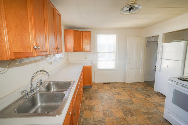 kitchen featuring sink and white electric range oven