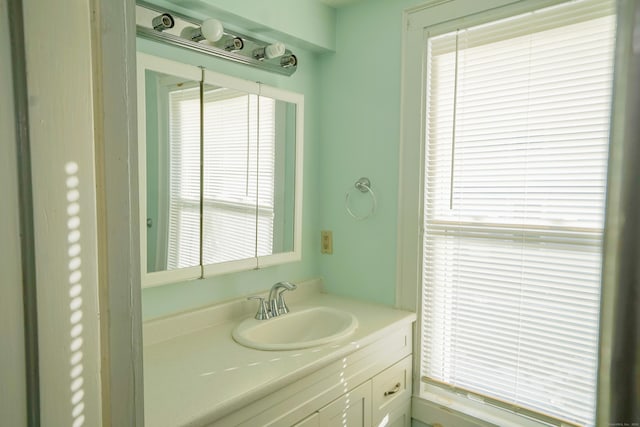 bathroom with vanity and plenty of natural light